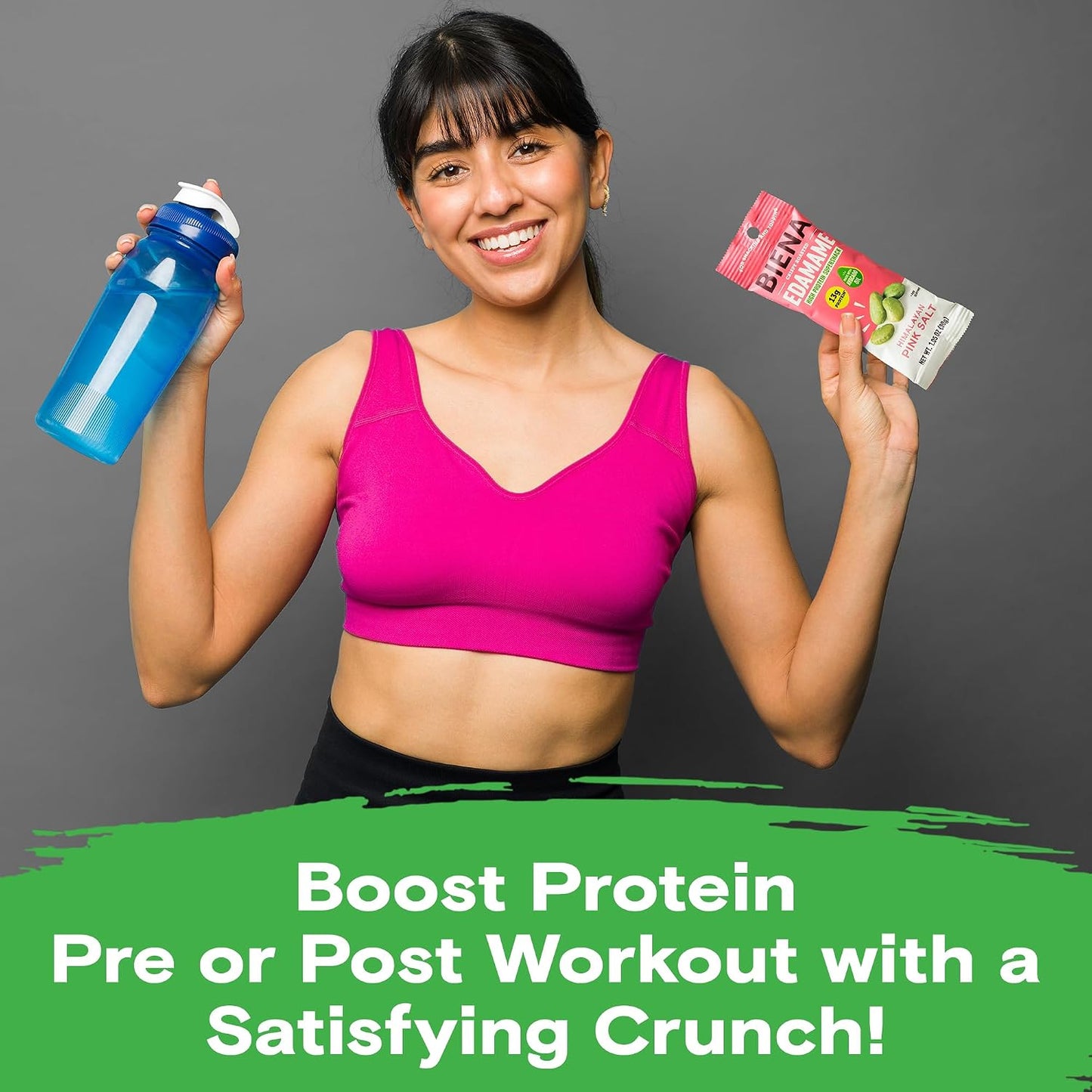 Female holding bottle & bag of Biena Himalayan Pink Salt Edamame Boost Protein Pre of Post Workout with a Satisfying Crunch!