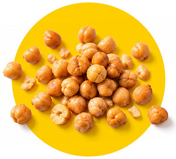 Batch of Chickpea Snacks behind a yellow circular background