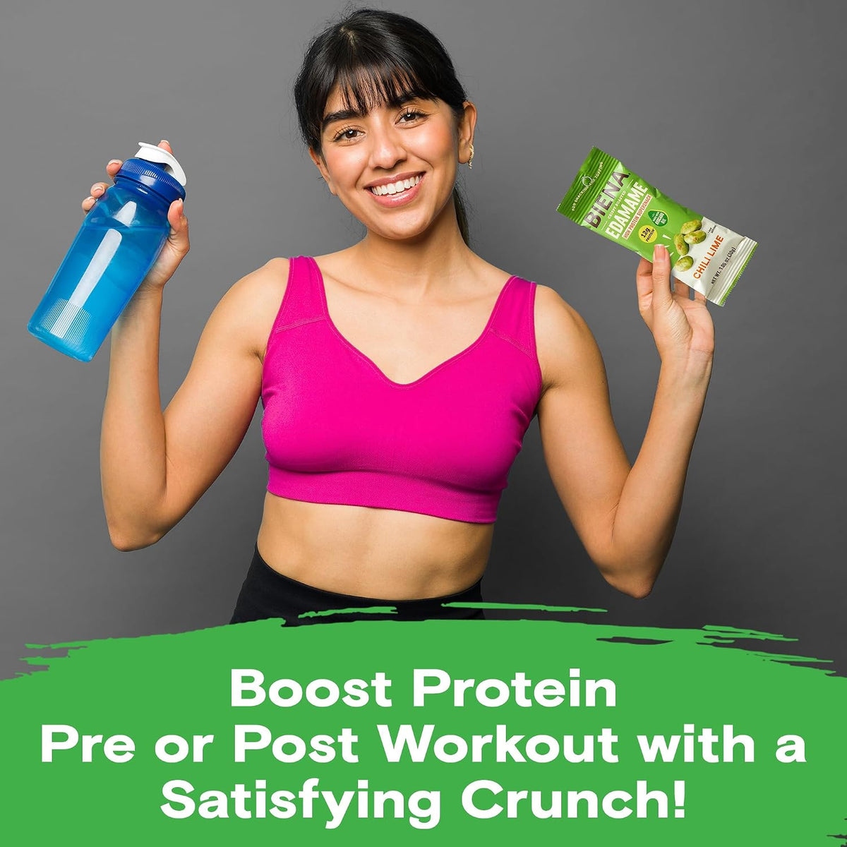 Female holding bottle and bag of Biena Chili Lime Edamame that Boost Protein Pre of Post Workout with a Satisfying Crunch!